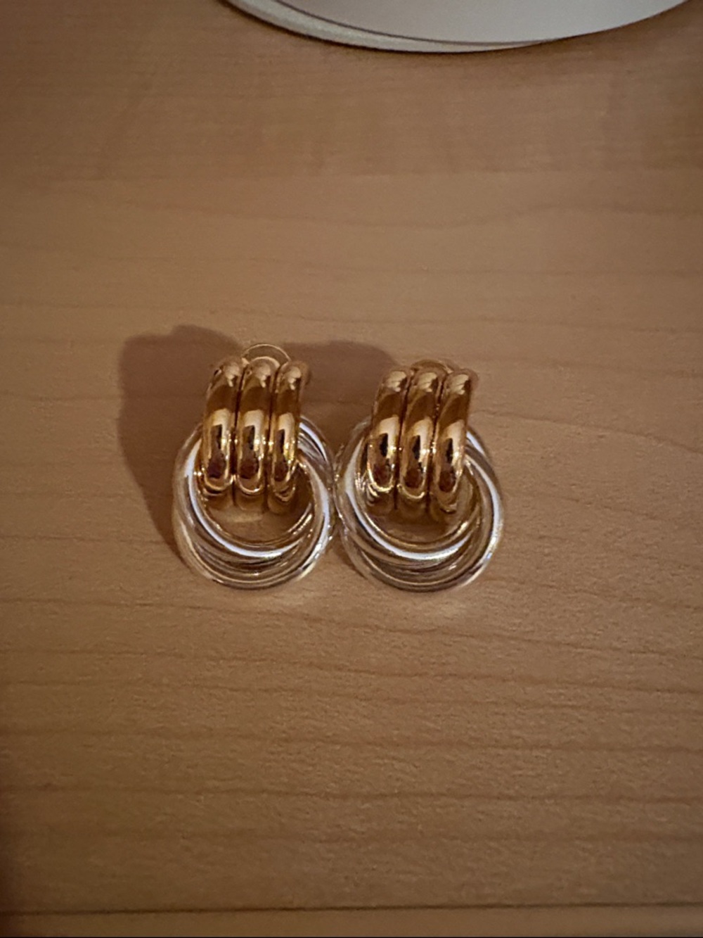 Heaven Mayhem two toned baby knot earrings
